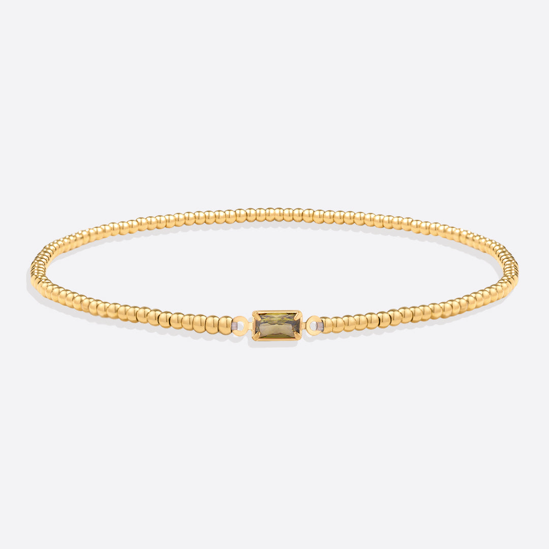 Bracelet of gold beads with birth stone