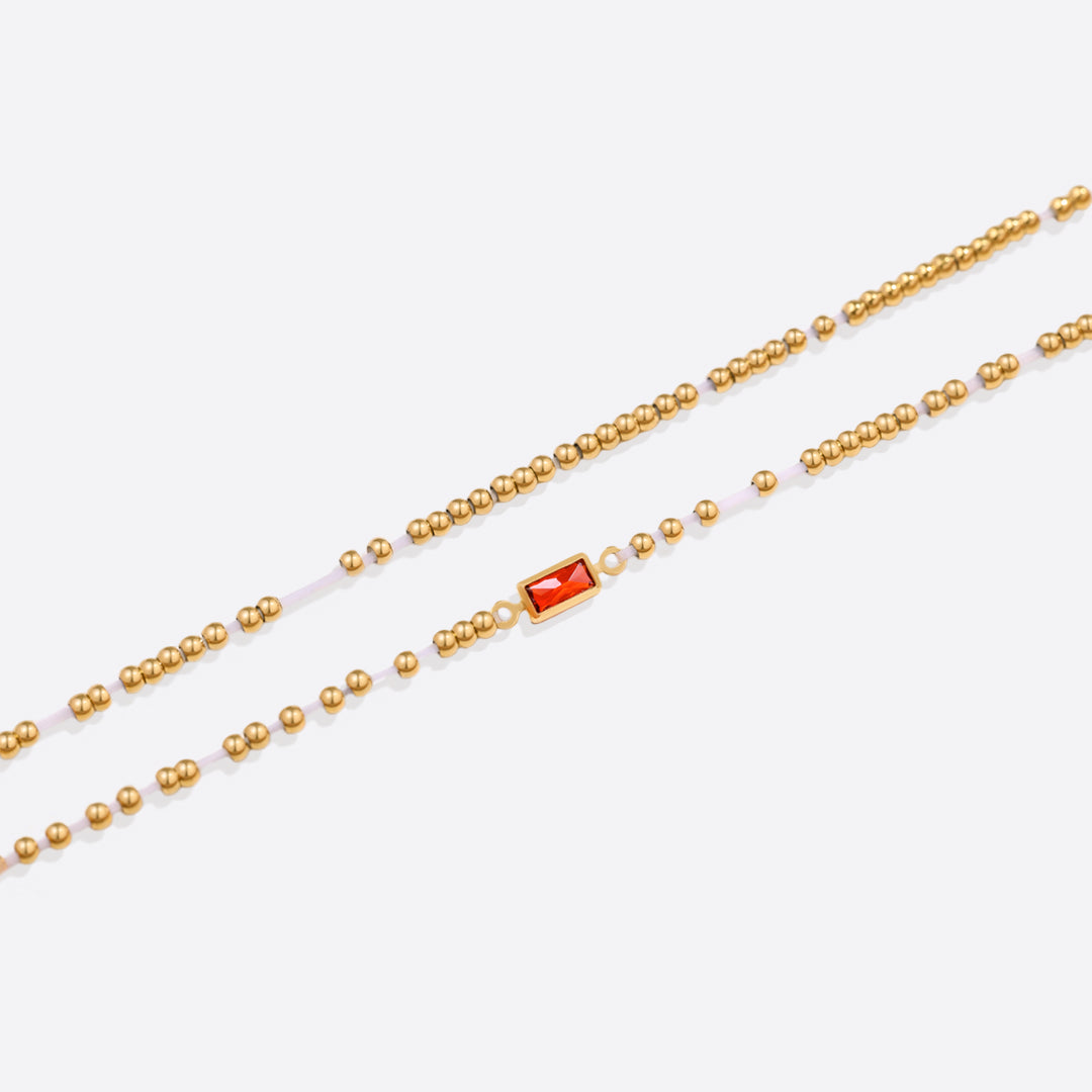 Bracelet of gold beads with birth stone