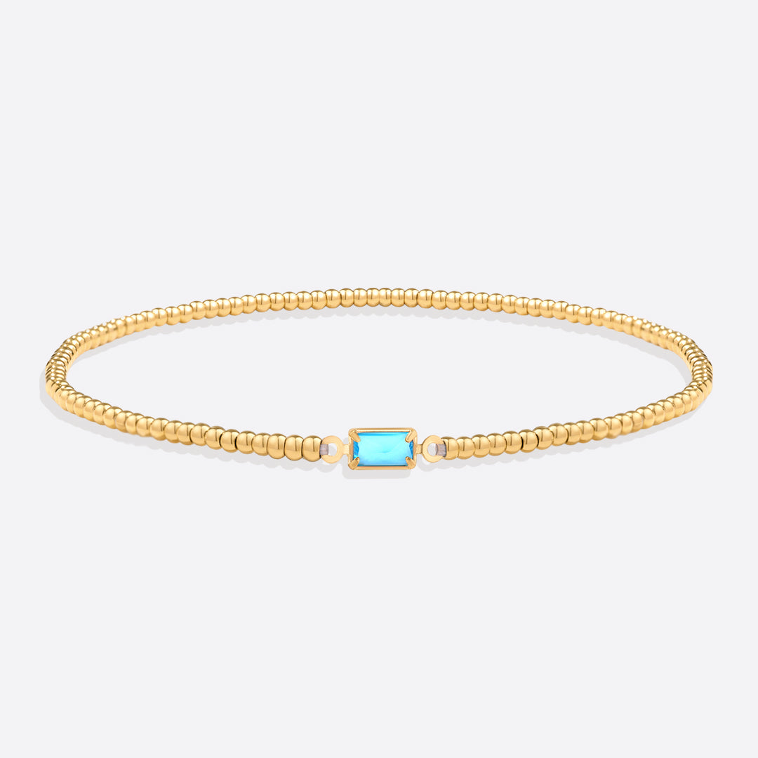 Bracelet of gold beads with birth stone