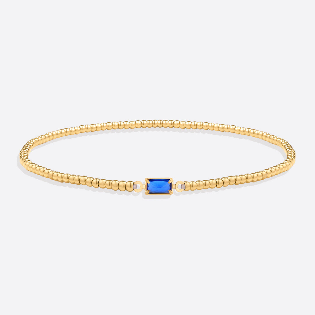 Bracelet of gold beads with birth stone