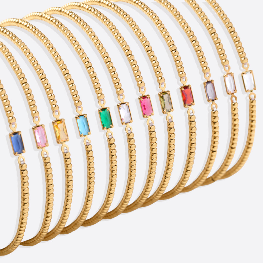Bracelet of gold beads with birth stone