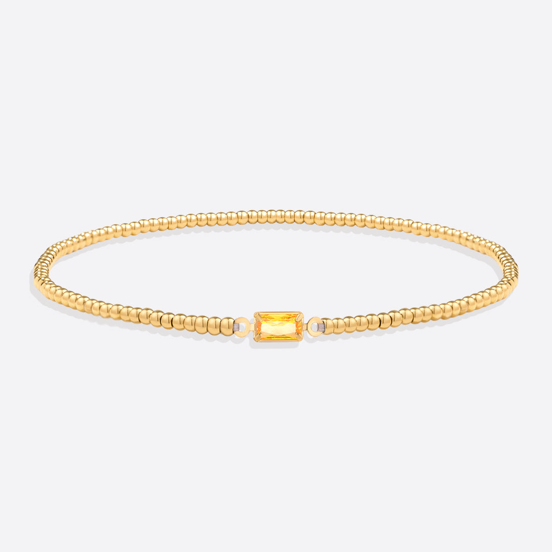 Bracelet of gold beads with birth stone
