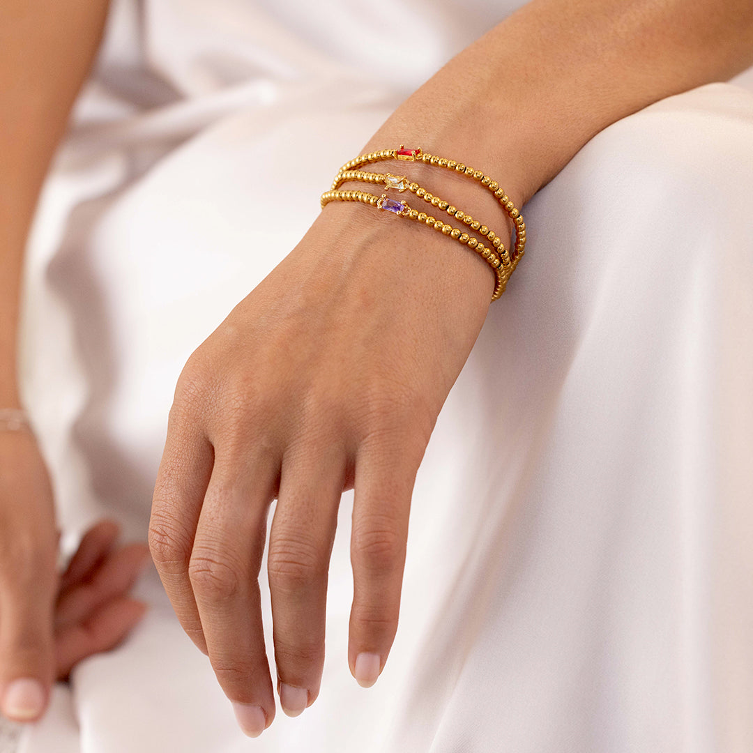 Bracelet of gold beads with birth stone