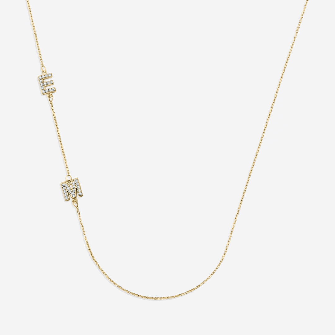 Necklace with the initials pave