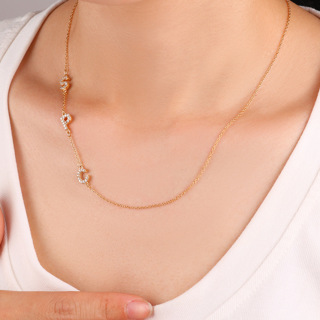 Necklace with the initials pave